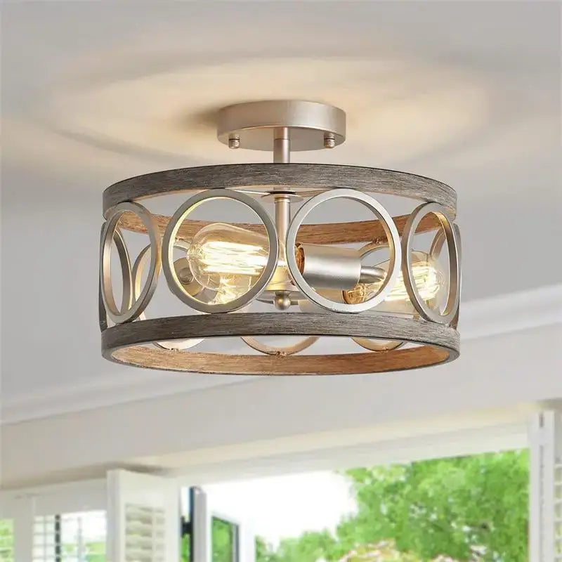 Rustic industrial farmhouse chandelier by decorbites with weathered wood frame and black metal rings for dining room light
