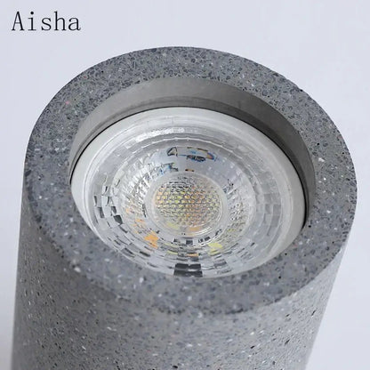Industrial led ceiling gray speckled concrete cylindrical led downlight with clear lens and metallic trim for kitchen decorbites