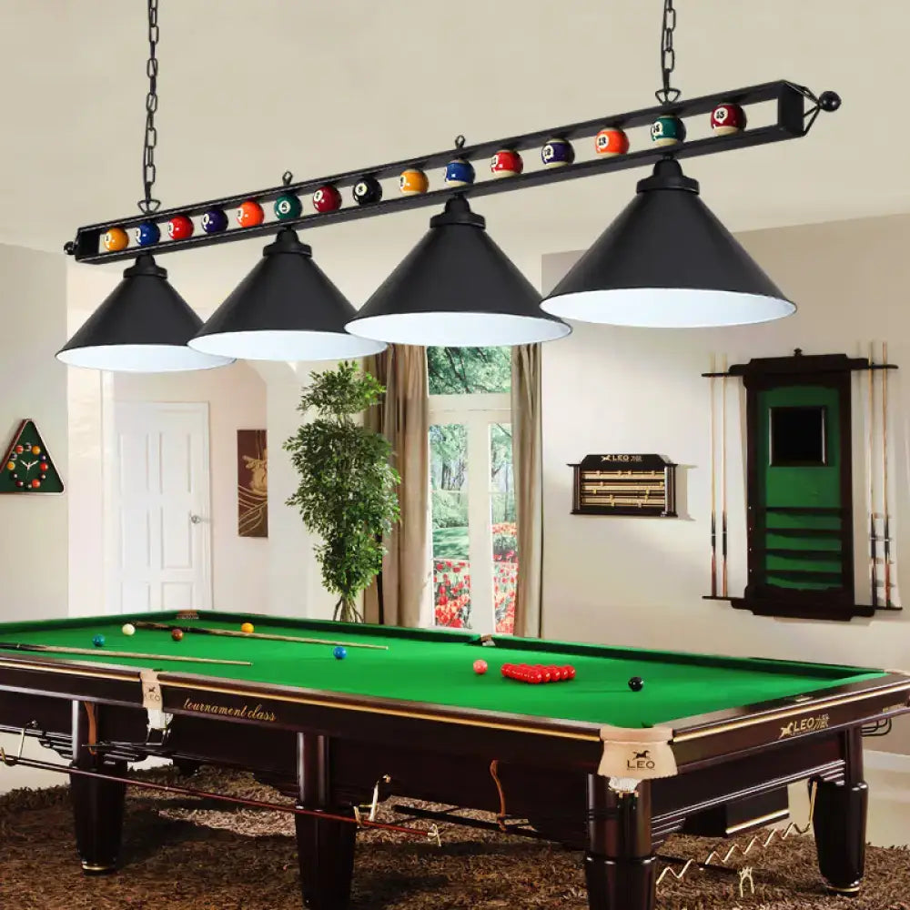 Black conical metal billiard lamp with white interior hanging over pool table featuring colorful billiard balls club island light