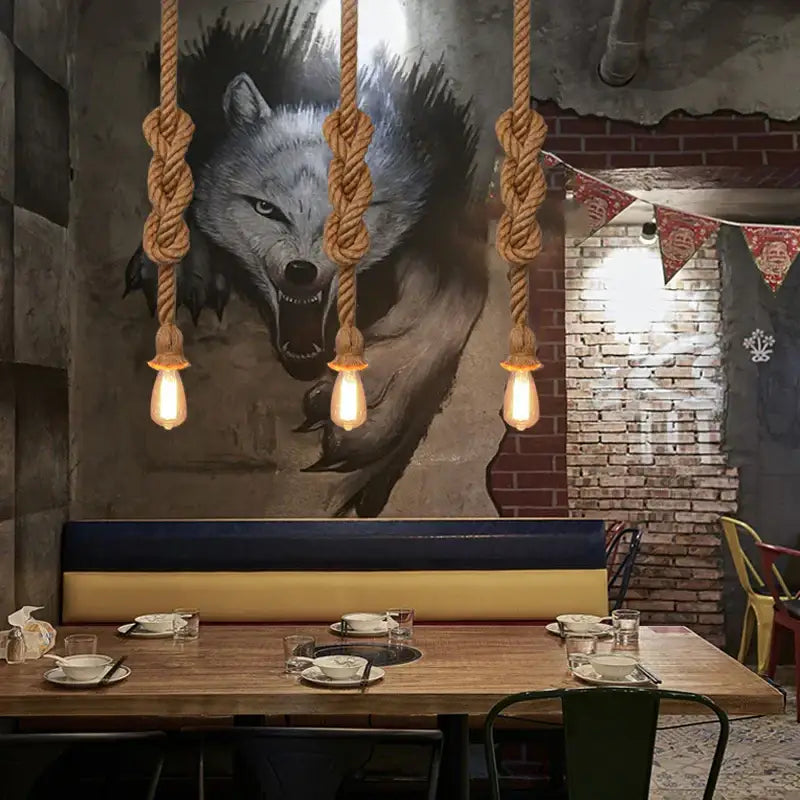 Three beige hemp rope pendant lights with exposed bulbs hanging for industrial dining room decorbites hemp rope chandelier