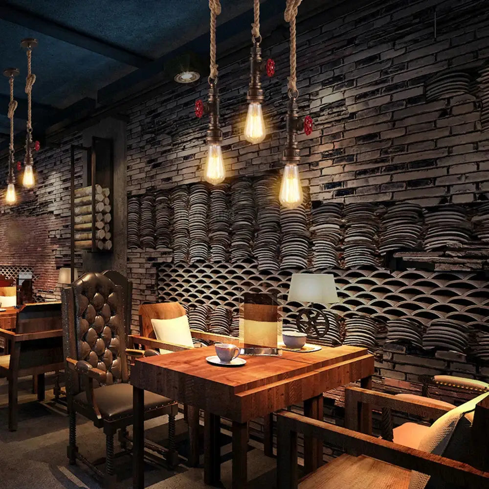 Industrial iron pipe pendant light with rope and exposed filament bulbs for dining room decorbites iron pipe pendant
