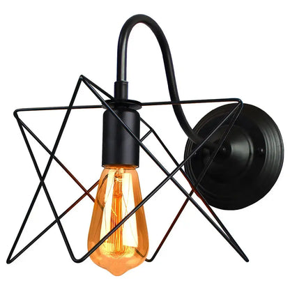 Black metal star-shaped industrial iron wall sconce decorbites featuring amber filament bulb for bedroom fixture