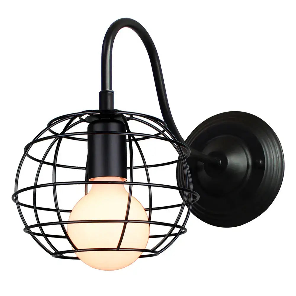 Black wrought iron wall sconce with cage design and warm glowing bulb by decorbites industrial iron wall fixture