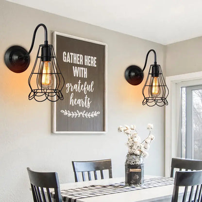 Black wrought iron cage wall sconce with exposed filament bulbs industrial iron wall decorbites fixture for bedroom