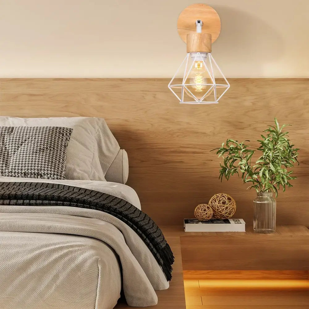 A warm-toned industrial led wood wall sconce with a circular wooden backplate and geometric wire cage housing an exposed bulb