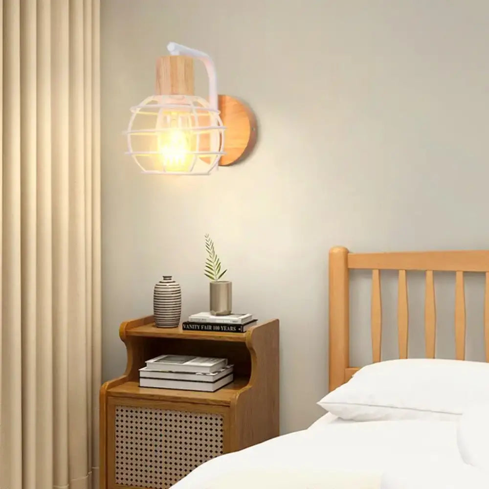 Warm-toned decorbites industrial led wood wall sconce with white metal cage and wooden base for bedroom decor