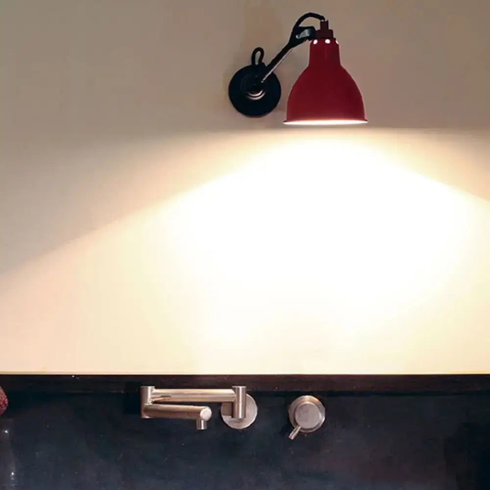 Red industrial wall lamp with black articulated arm and circular base compatible with 110v-120v and 220v-240v led bulbs