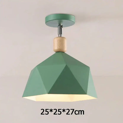 A modern sage green pendant light with faceted shade and wood accent for decorbites industrial loft ceiling decor