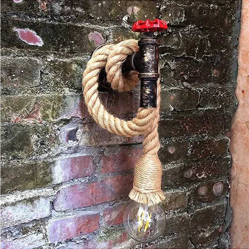 Industrial loft wall lamp with black pipe, red valve handle, and hemp rope holding clear glass bulb by decorbites industrial loft