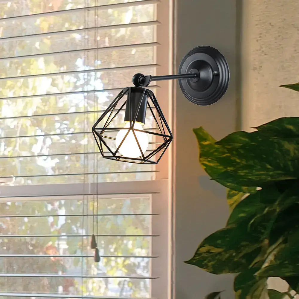Black geometric wireframe industrial loft led cage wall sconce with warm glowing bulb for bedroom decorbites industrial loft