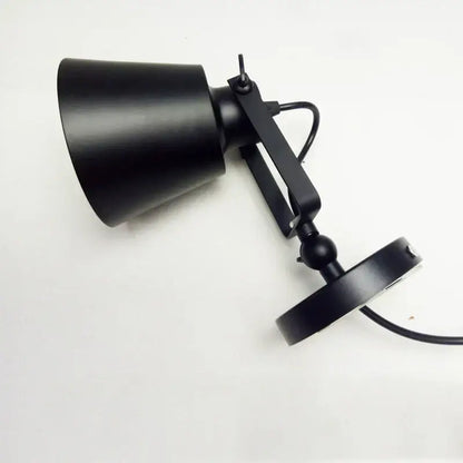 Black matte-finished industrial wall light with adjustable edison wall arm and conical shade for bedroom sconce decorbites