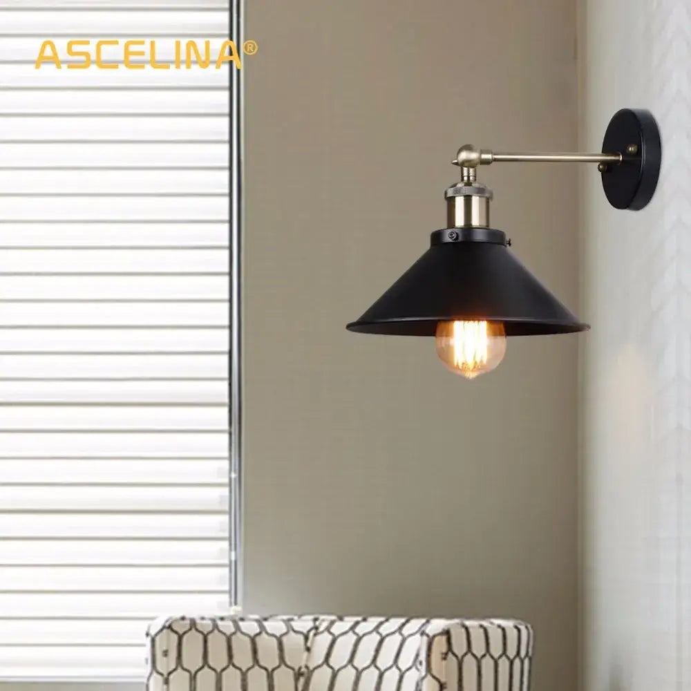 Industrial matte black and brass wall sconce with visible filament bulb for living room lighting decorbites industrial wall