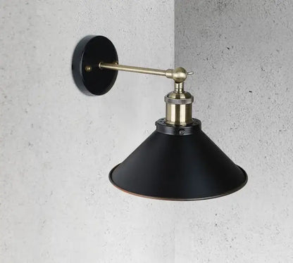 Black matte wall sconce with brass accents and conical shade for living room decorbites industrial wall lighting