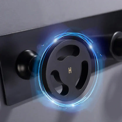 Black circular showerhead with glowing blue rim paired with decorbites industrial style basin faucet with dual handles