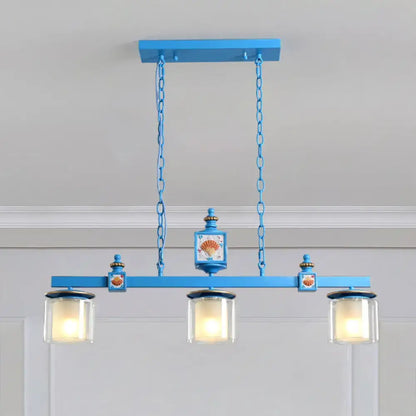 Decorbites sky blue dual cylinder parlor island pendant lamp with clear and frosted glass and shell motifs on metal fixtures