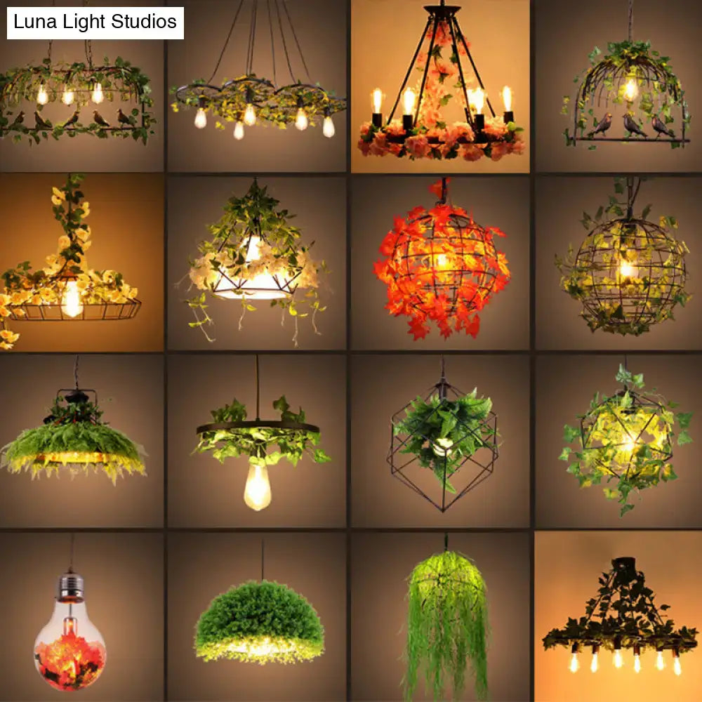 A decorbites™ industrial metal black pendant light featuring rustic wrought iron and artificial greenery for 220v-240v use