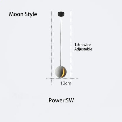 Moon-style pendant lamp with matte gray cement sphere and golden crescent by decorbites cement chandelier hanging on black wire
