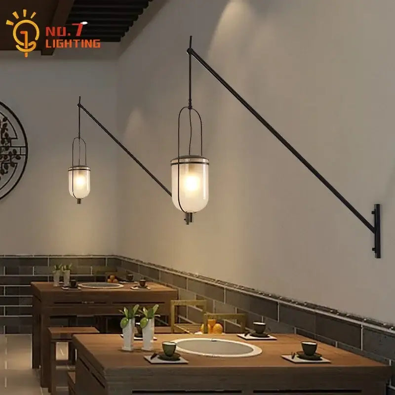 Industrial retro black led wall lamp with a metal arm and frosted glass shade for warm dining room illumination