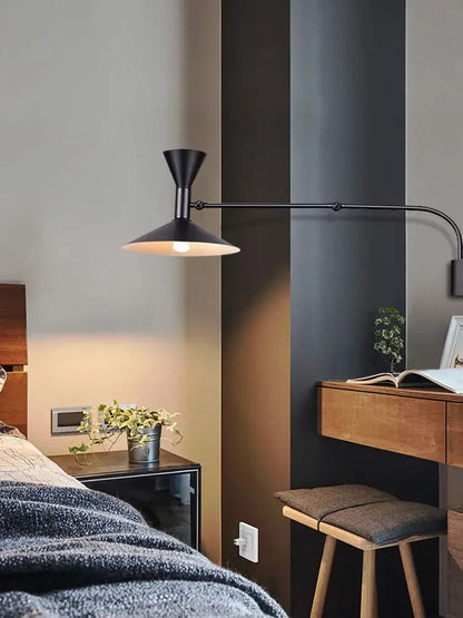 Black metal swing arm wall lamp with conical shade and curved arm for industrial retro bedroom lighting