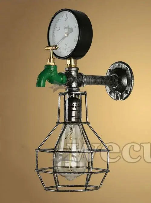 Industrial retro wall sconce with green faucet, black pressure gauge, brass fittings, and exposed edison bulb cage for decorbites