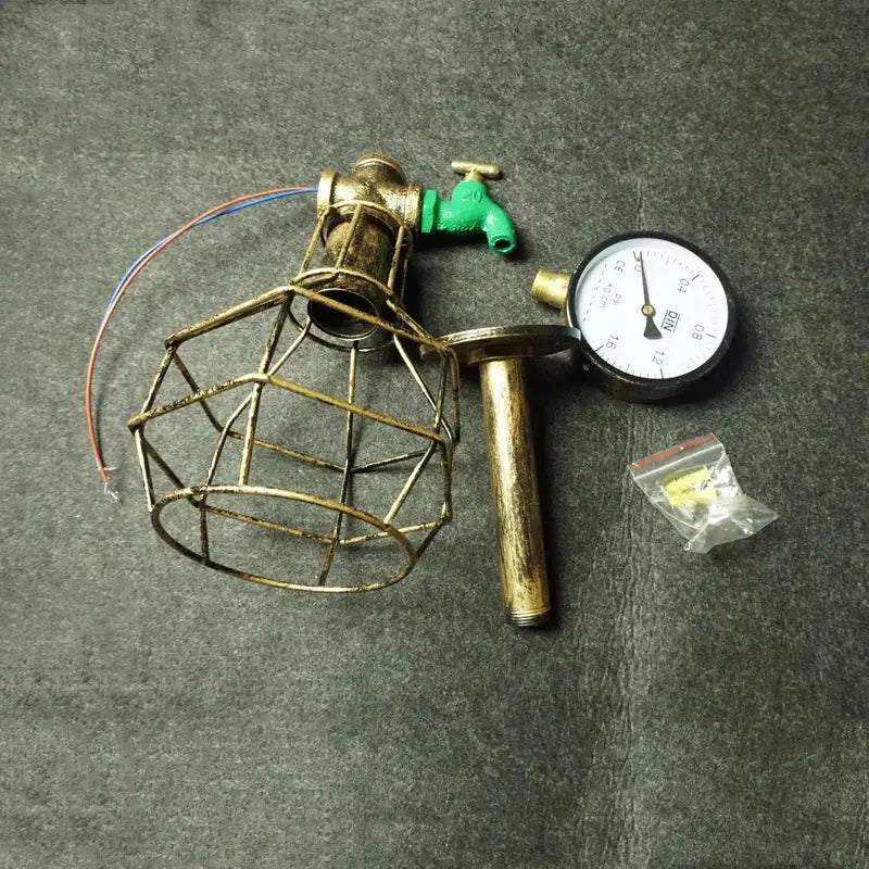 Industrial retro wall lamp featuring a brass cage, green faucet accent, and pressure gauge for bedroom steam punk decorbites industrial retro style