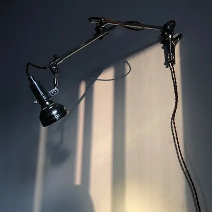 Black adjustable wall lamp with matte finish and braided cord industrial retro decorbites industrial retro sconce