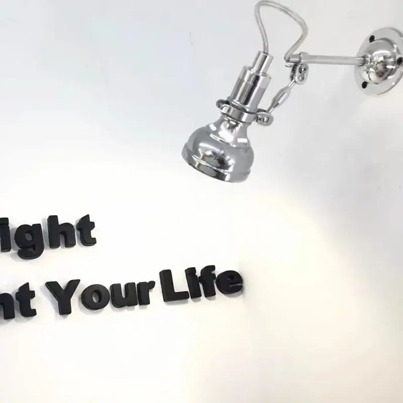 Chrome-finished adjustable industrial retro wall lamp with articulated spotlight for bedroom decorbites industrial retro design