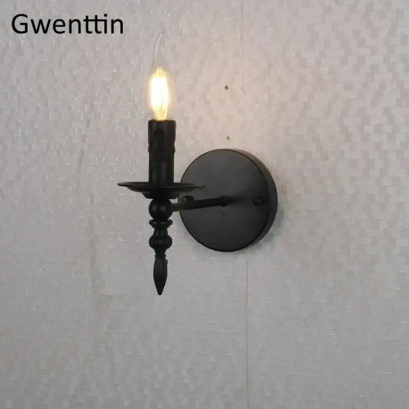Black wrought iron candle-style industrial retro wall sconce with glowing bulb for bedroom decorbites industrial retro use