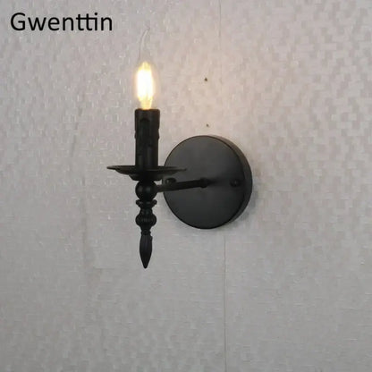 Black wrought iron candle-style industrial retro wall sconce with glowing bulb for bedroom decorbites industrial retro use