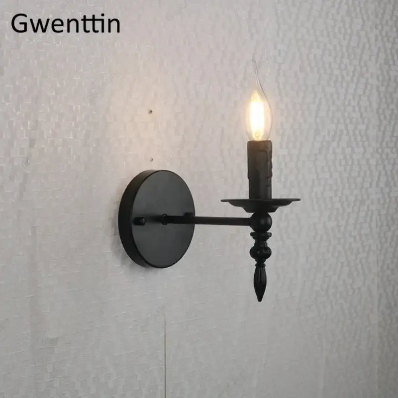 Black wrought iron industrial retro wall sconce with candle-style lit bulb for bedroom decorbites decorbites industrial retro