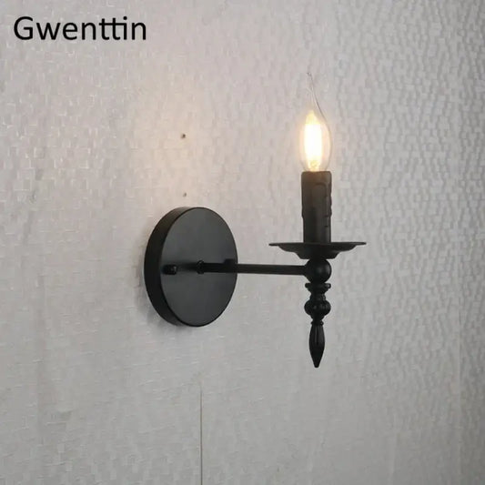 Black wrought iron industrial retro wall sconce with candle-style lit bulb for bedroom decorbites decorbites industrial retro