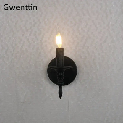 Black wrought iron industrial retro wall sconce with candle-style glowing bulb for decorbites industrial retro bedroom decor