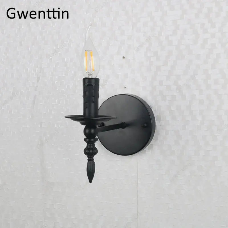 Black wrought iron industrial retro wall sconce with vintage candle style and exposed led filament bulb for bedroom decor