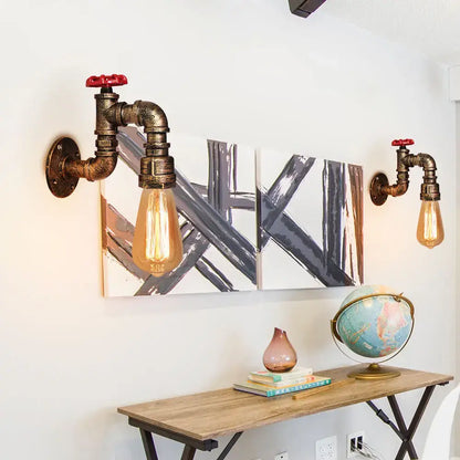 Industrial rusted iron water pipe wall lamp with brass-finished pipe, red valve, and exposed edison bulb for decorbites iron water lighting