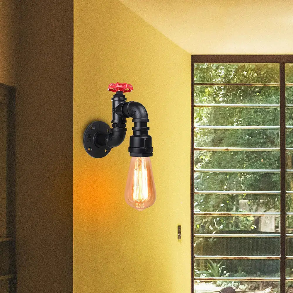 Black industrial rusted iron water pipe wall lamp with red valve handle and exposed filament bulb by decorbites iron water
