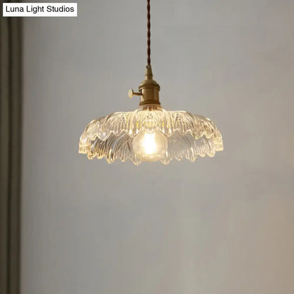 Clear scalloped edge glass pendant ceiling light with brass fixture and twisted cord for industrial decor