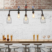 DecorBites™ industrial black pipe hanging lamp with four exposed bulbs, metallic caged design, and pressure gauge accents