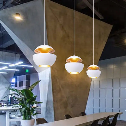 Three white spherical industrial style led pendant lights with gold interiors for matte black kitchen split dome style led pendant