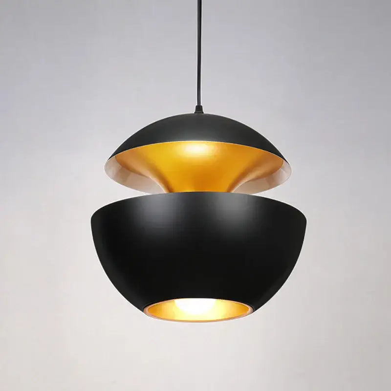 Industrial style led pendant light with black matte exterior and gold reflective interior split dome design for kitchen use