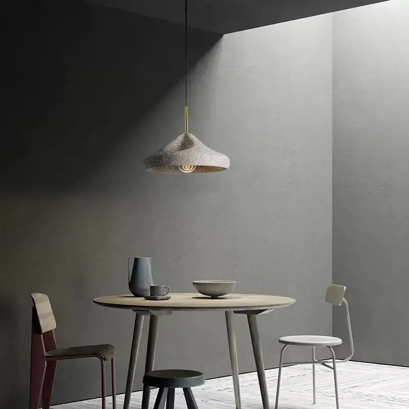 Industrial style pendant chandelier with textured gray concrete shade and brass-finished hanging rod for bedroom decorbites industrial style