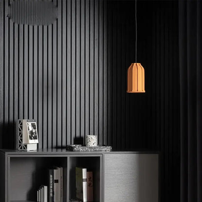 A warm orange decorbites cement pendant lamp with fluted geometric design for dining room hanging light decorbites cement