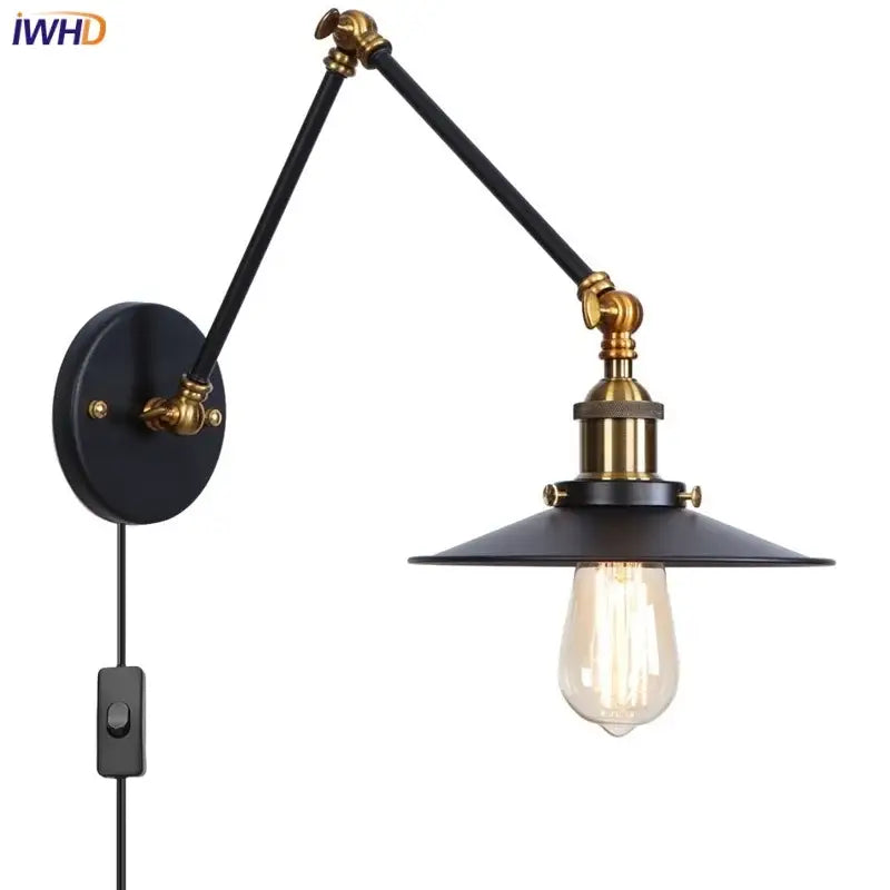 Industrial vintage black iron wall light with adjustable long arm black iron and brass accents featuring vintage edison bulb