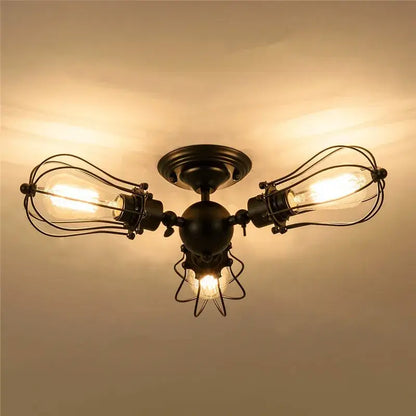Industrial vintage black metal cage ceiling light with three exposed filament bulbs for dining room decorbites industrial vintage