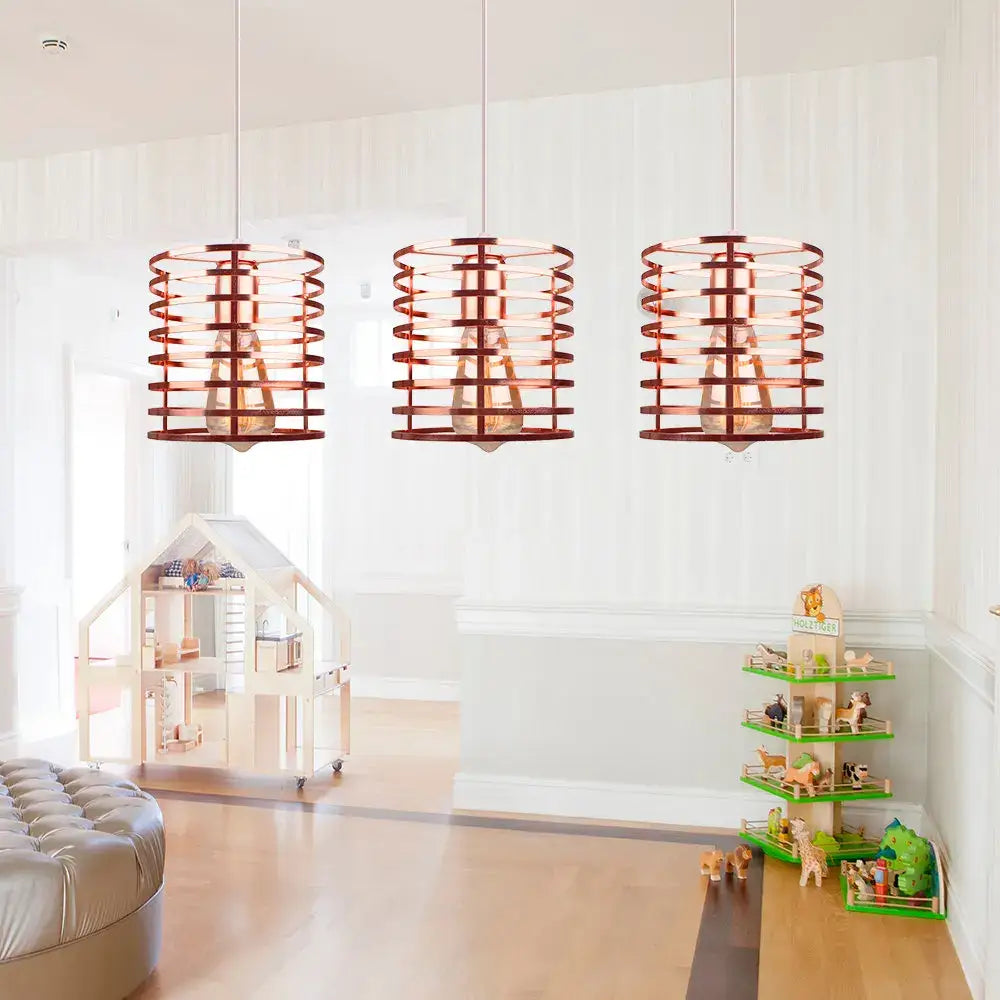Three copper-colored cylindrical pendant lights with woven cage design in decorbites industrial vintage led style