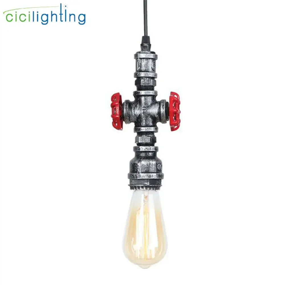 Industrial vintage brass and black pipe pendant light fixture with red handles and exposed filament bulb for kitchen use