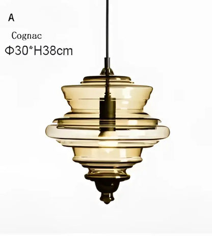 Cognac-colored industrial vintage glass pendant lamp with tiered rings and brass fixture for dining room decorbites industrial vintage