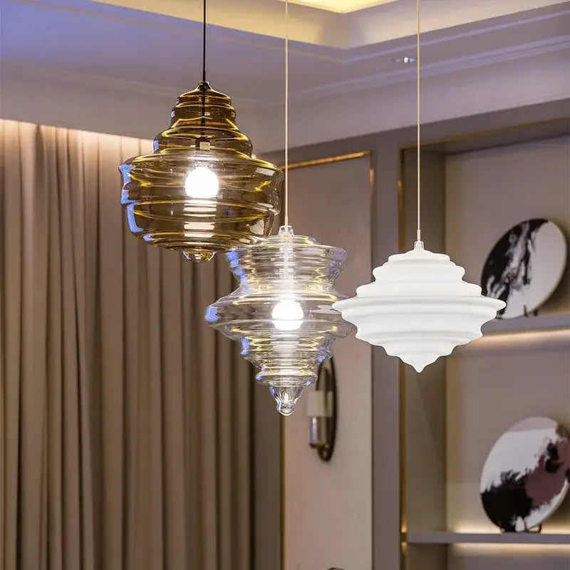 Three tiered industrial vintage glass pendant lamp with amber gold and clear frosted accents for dining room decor