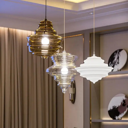 Three tiered industrial vintage glass pendant lamp with amber gold and clear frosted accents for dining room decor