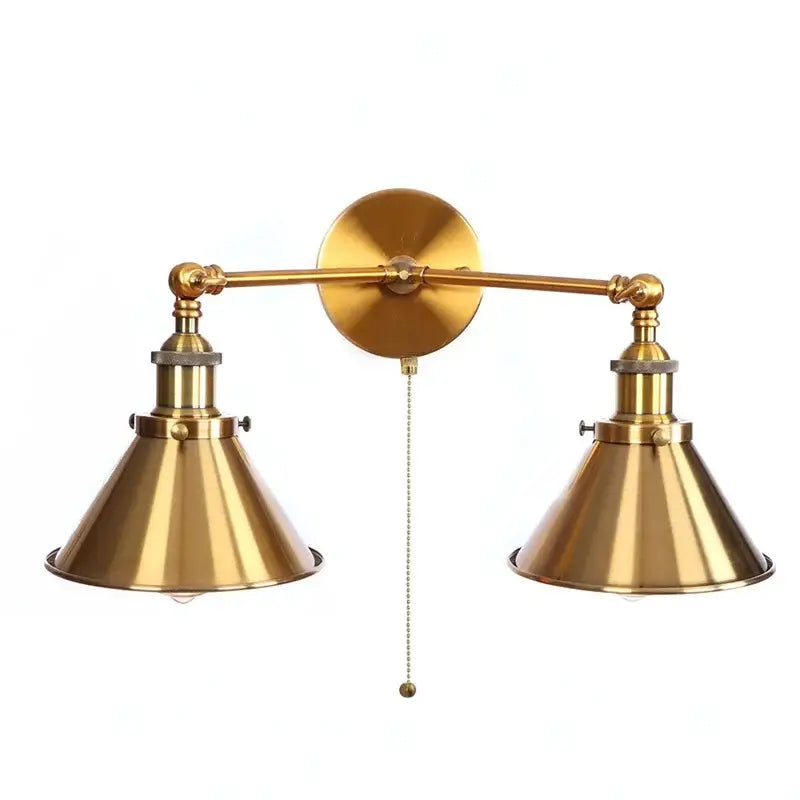 Brass double-arm wall light with conical shades and central pull chain in decorbites industrial vintage style