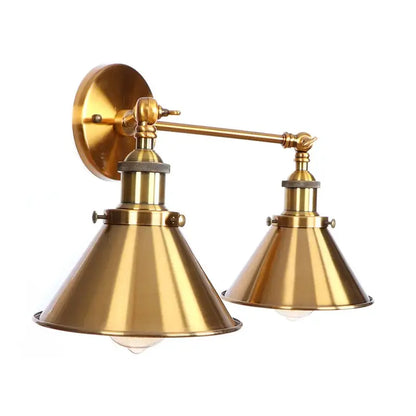 Brass double-arm wall light with conical shades in decorbites industrial vintage style for bedroom lighting